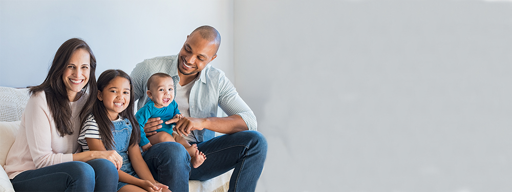 Picture of a family sitting on a couch